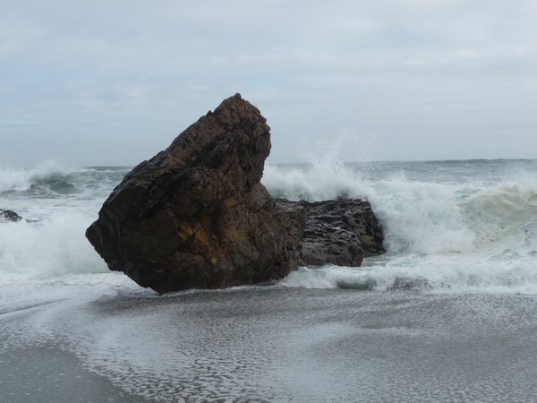 Sea crashing against a rock