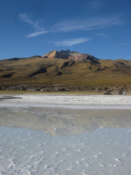Tunupa volcano reflecting in the Salar
