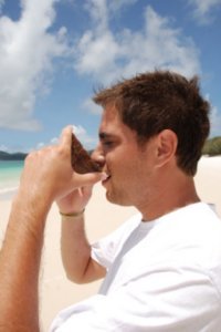 Marco drinking a coconut