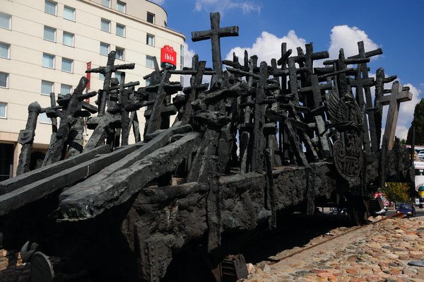 13 - I assume the crosses are the lives lost on the carriage being transported in a burned out carriage that represents the cremating of the bodies after the gas chambers   I am just assuming on this one