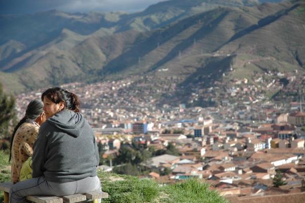 Local women looking over Cuzco at sundown