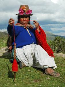 Local woman weaving llama wool