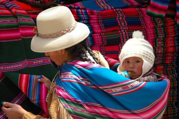 Mother and child shop for textiles in La Paz street market