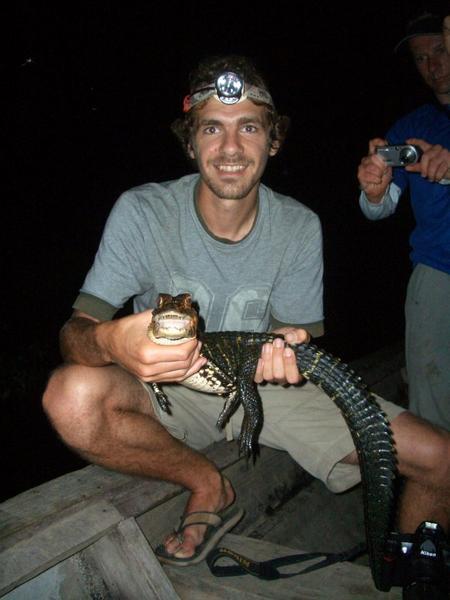 Me holding baby black caiman