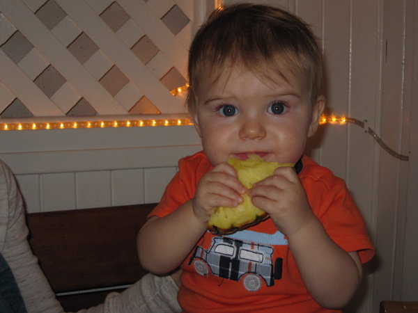 Landon tries his first pineapple