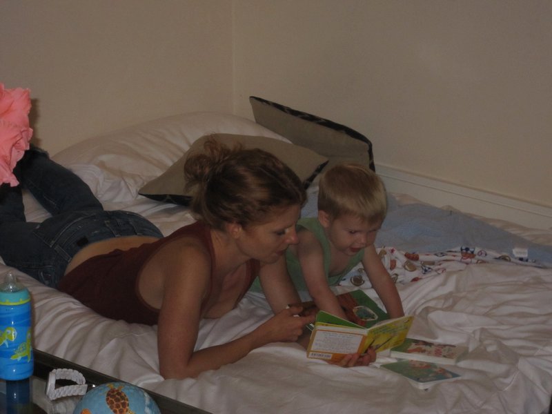 Reading with Landon on the extra mattress at 48 Wells