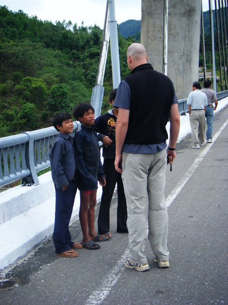Tall guy and Vietamese kids