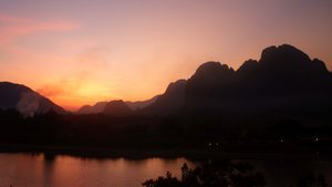 Sunset view from our hotel in Vang Vieng... before the clouds came in
