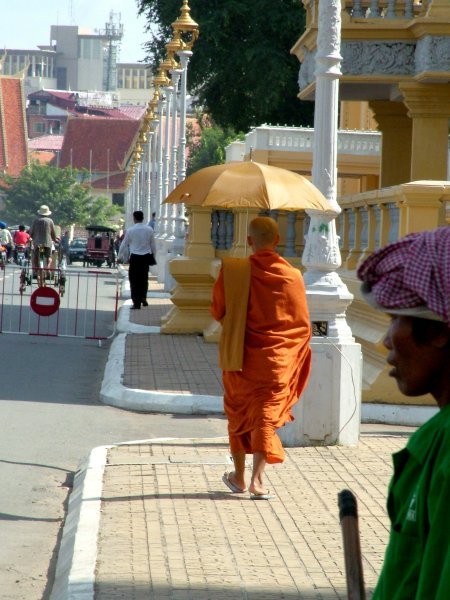 Monk walking along the Royal Palace