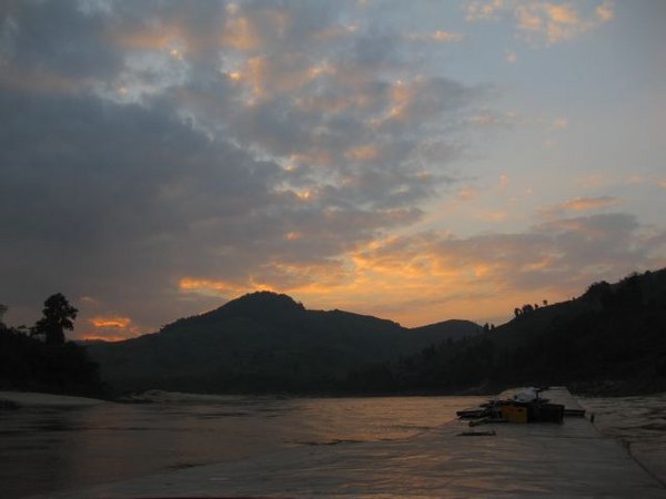 Sunset over the Mekong and our boat
