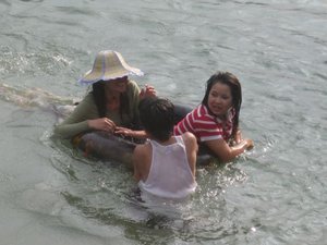 Lao people swim clothed