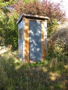 Rob built this outhouse, and it's the nicest one we've ever had the luxury of s(h)itting in.