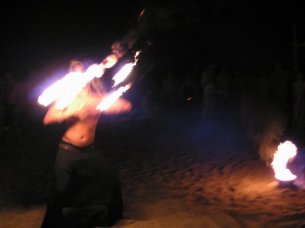 Beach fire dancer