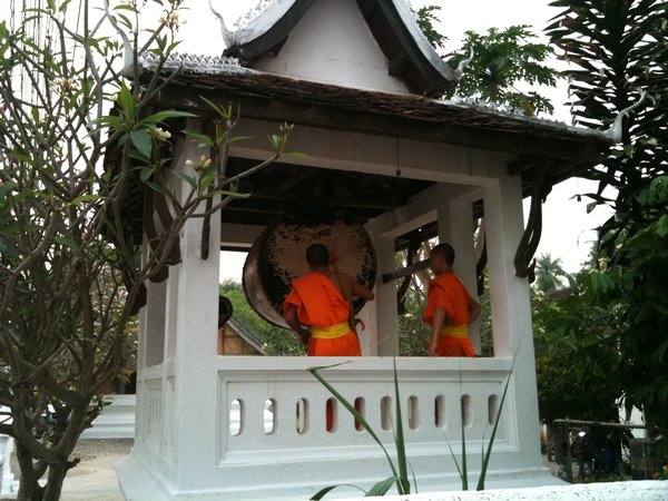Monks banging drums