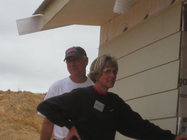 Joan and Bill working hard on the weatherboards