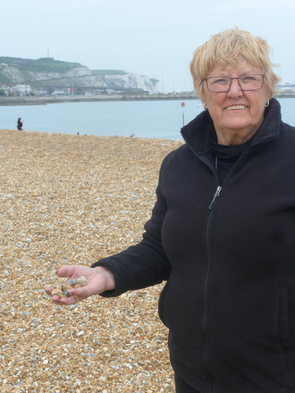 Jean collecting beach rocks for Grandson Ben
