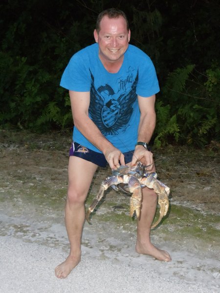 A Man Holding a Crab