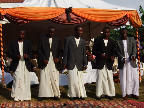 The brothers in the tradtional dress called a "kanzu"