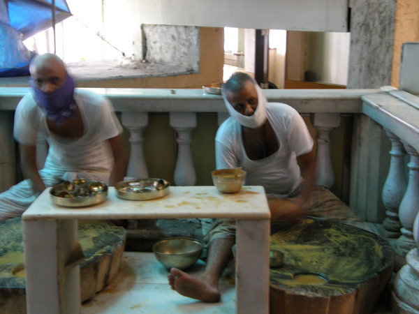 Jains making sandlewood paste