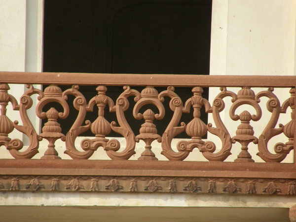 Scrollwork on balcony of cortisan courtyard