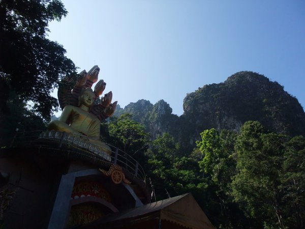 Cliff escarpment surrounding Buddha statue