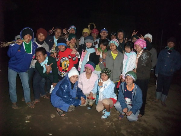 The group we followed around the camps on the first night when they sang at families' homes