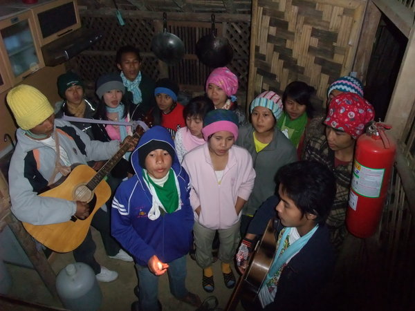 The group singing to us at our guesthouse