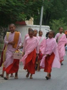 Nuns walking along the bottom of Sagaing Hill
