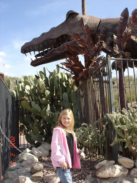Bella next to the dinosaur