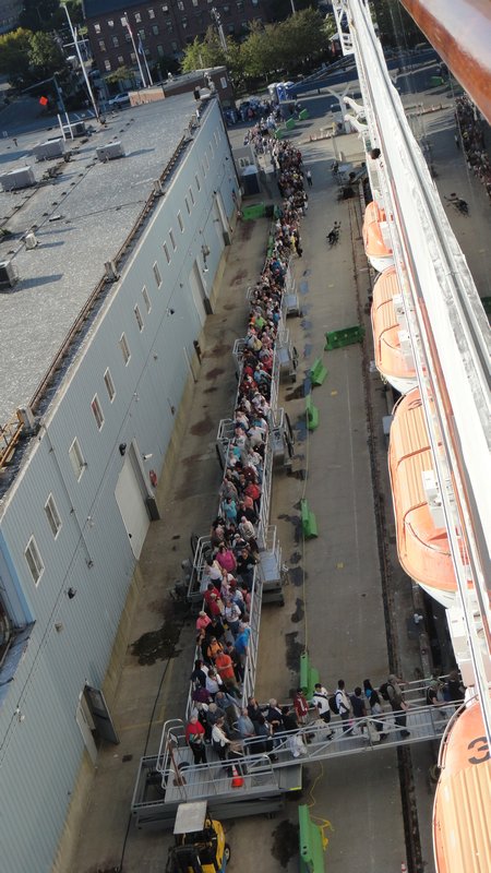 Long line waiting to get on ship