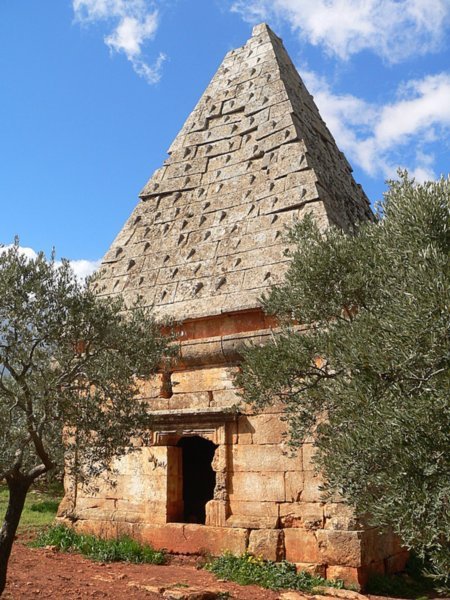 pyramid tomb among olive trees