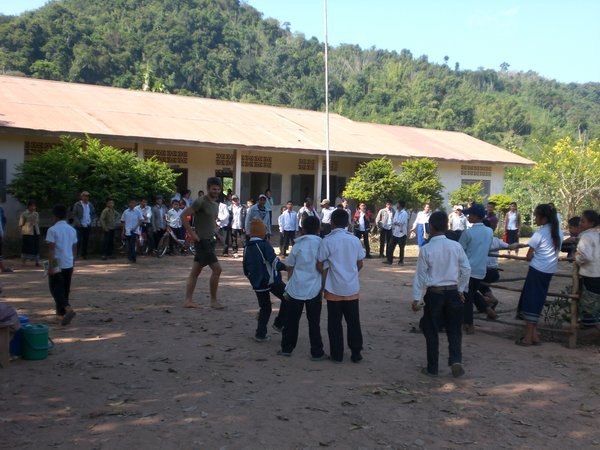 playing bamboo football with the kids in the schoolyard