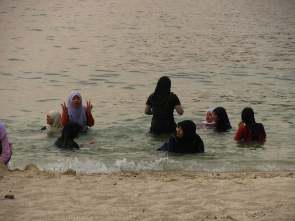Muslim women bathing with their clothes