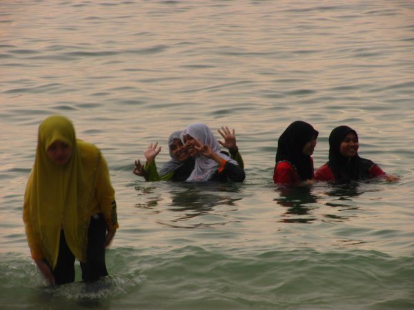Muslim women bathing with their clothes