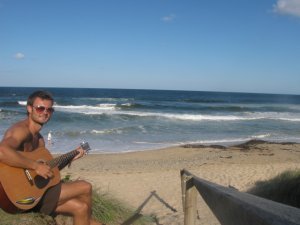 Playing guitar at the Beach