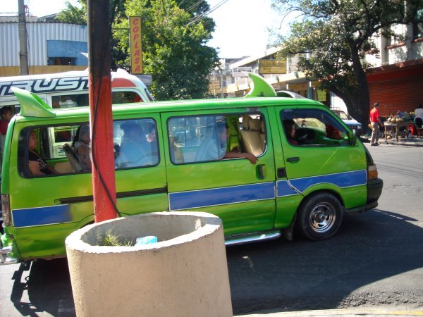 Green bus with fins in San Salvador, El Salvador