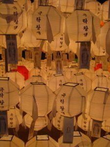 100's of white lanterns and flags