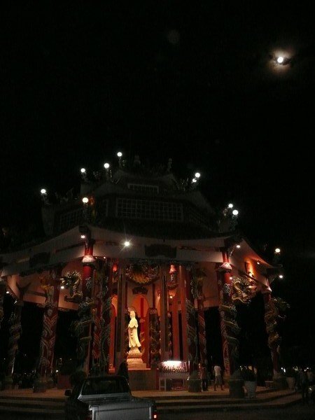 Full moon over Chinese-style temple