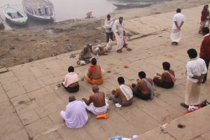 praying on a ghat of the Ganges 