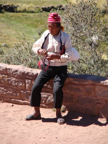 Weaving man on the island of Taquile