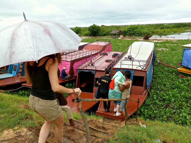 boarding boat to visit floating villages