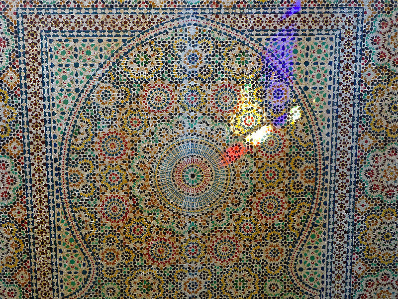 mosaic water fountain in hotel lobby