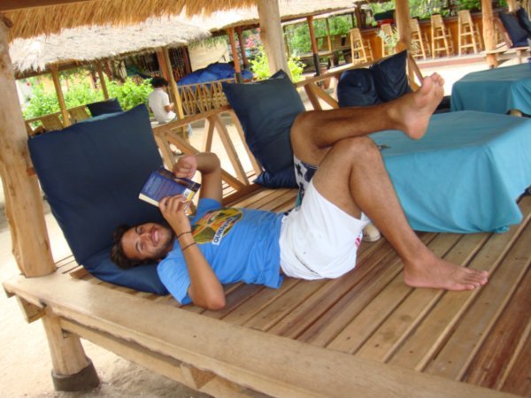 Jay reading on beach hut