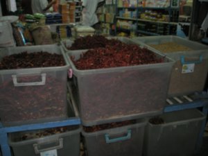 Buckets of dried Chilli's in shop