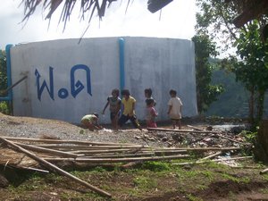 Hilltribe Kids Playing by the Water Tank