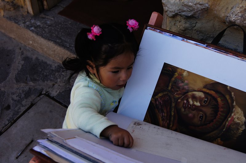 Little Peruvian Girl Looking at Paintings