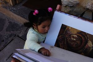 Little Peruvian Girl Looking at Paintings