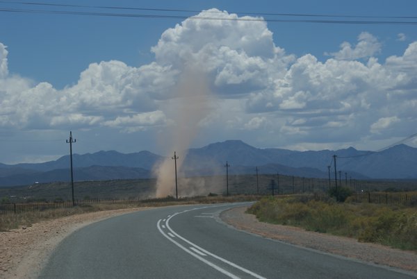 A dust devil  - small desert tornado