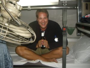 Steve testing a Singha on the new and improved night train bed!