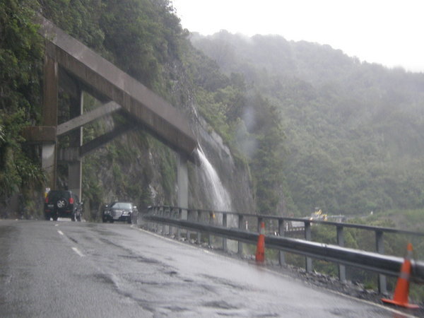 Waterfall over the road.